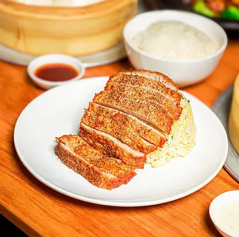 Ugly Dumpling pork chop fried rice on a plate